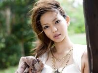 Hot And Sexy Brunette Chick From Japan Yura Aikawa Is Sexily Posing Outdoors Under The Tree