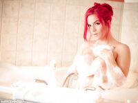 Foam Is All Over Busty Redhead Harley Rose And She Is Willing To Pose For Us In The Bathroom.