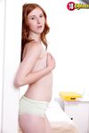 Hot Red Haired Babe Linda Sweet Shows Some Skin In The Bedroom As She Poses