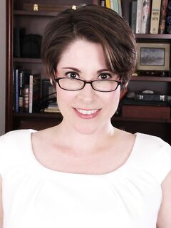 Short Haired Brunette Sadie Jones Plays With Her Trimmed Pussy In Study Room