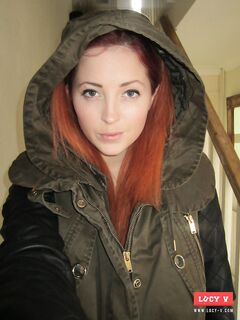 Sassy Lucy Vixen Is Taking Off Her Rain Coat Demonstrating Big Naked Tits Underneath