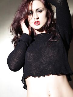 Hot Softcore Redhead Karlie Montana Strips To Pose In Black Panties And Give Out Dirty Looks.