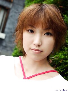 Cute Looking Asian Girl Madoka Ozava Is Lifting Her Top Up Uncovering The Boobs