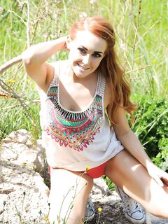 Charming Redhead Doll Lucy Anne Is Stripping And Getting Warmed Up Naked On The Stone