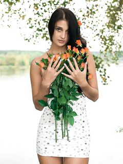 Naughty Brunette Chick Katya AC Is Posing With The Nude Bottom And Bouquet Of Flowers
