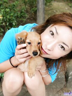 Posing With A Dog Is What One Of The Best Asian Babes Nao Idols Loves To Do.