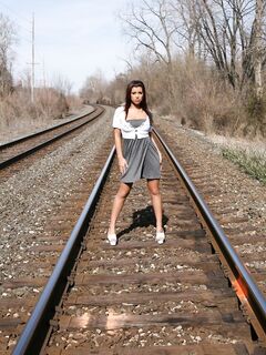Sweet Latino Girl Briana Lee Is Posing In Her Sexy Dress On Railroad Tracks And Teases
