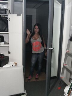 Baring Her Tight Jeans And Sexy Lingerie Busty Brunette Nikki Delano Poses On The Office Table