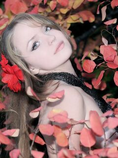 The Beautiful Blonde Teen Manilla A Is Erotically Posing Naked Against The Blossoming Bush