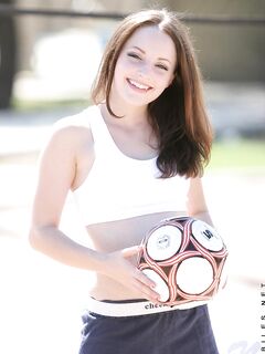 Smiling Sportive Girl Tabitha Nubiles In Snow White Top And Blue Shorts Poses With A Ball Outside photos (Tabatha Sweet)