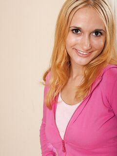 Charming Leslie Love Gives A Smile Before She Bares Her Sexy Boobs And Shaved Pussy